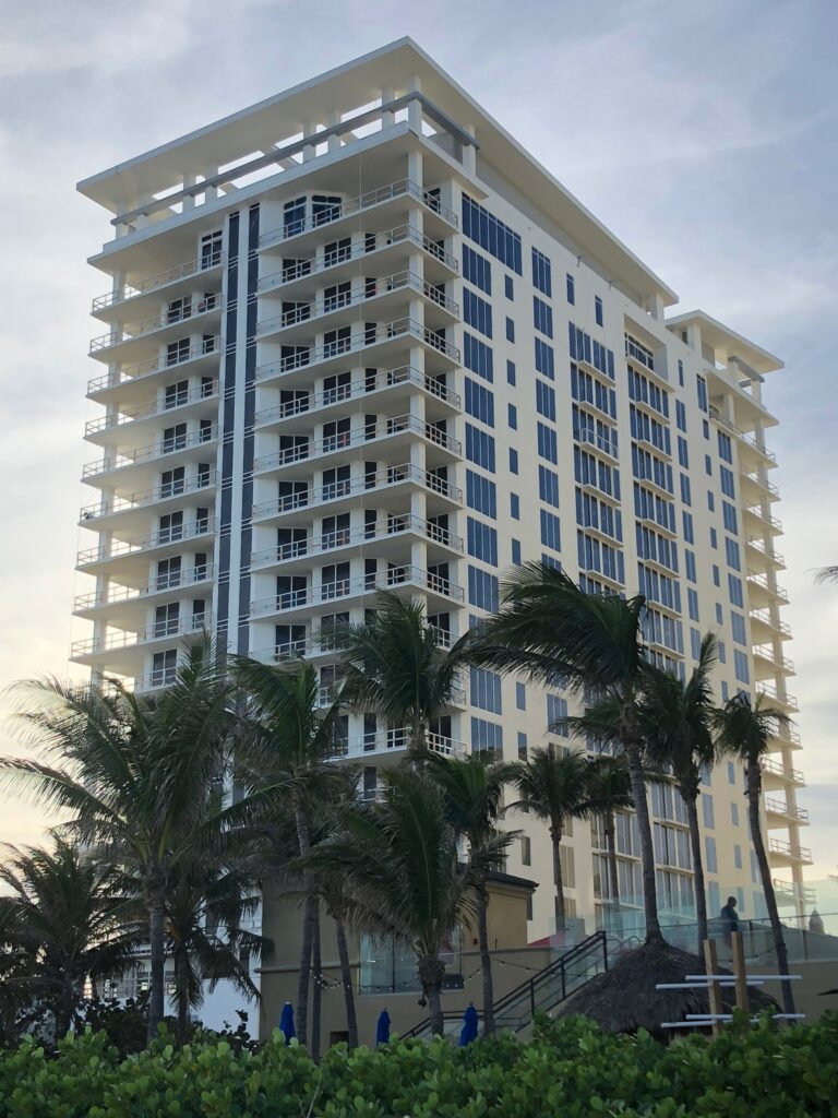 Photo showing the exterior of the building against a sunset backdrop