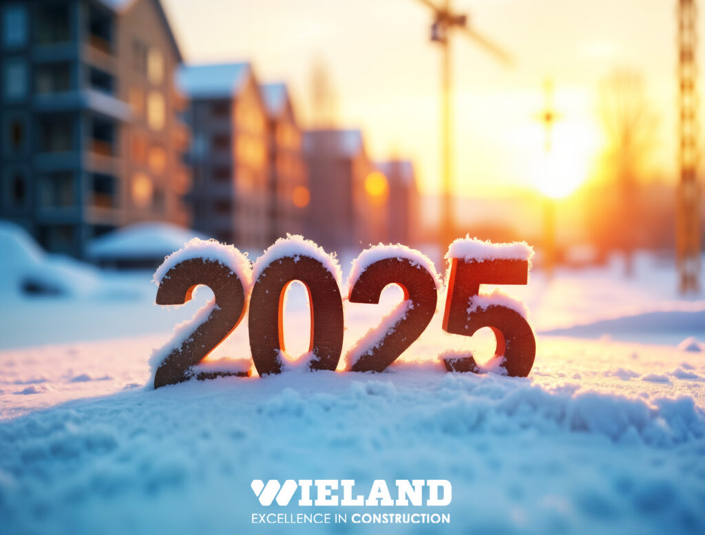 Graphic with 2025 covered in snow on an active jobsite