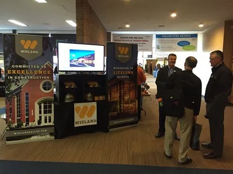 Team standing in front of WIELAND booth