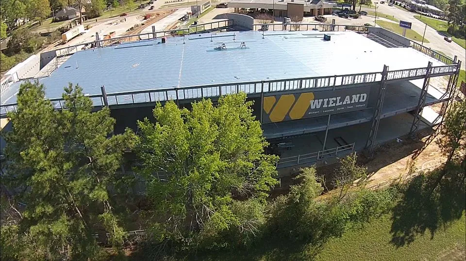 Overhead view of project in progress with WIELAND banner hanging on its side.