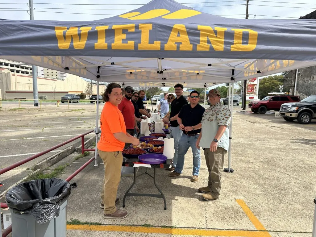 Crawfish cookout tent with WIELAND team members serving up