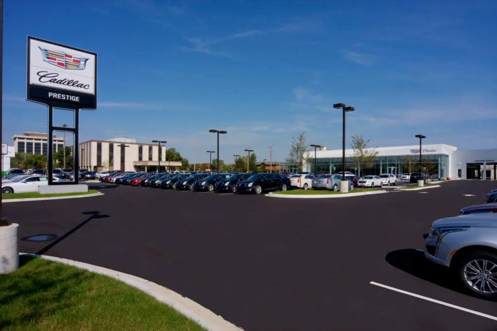Prestige Cadillac sign and car lot render