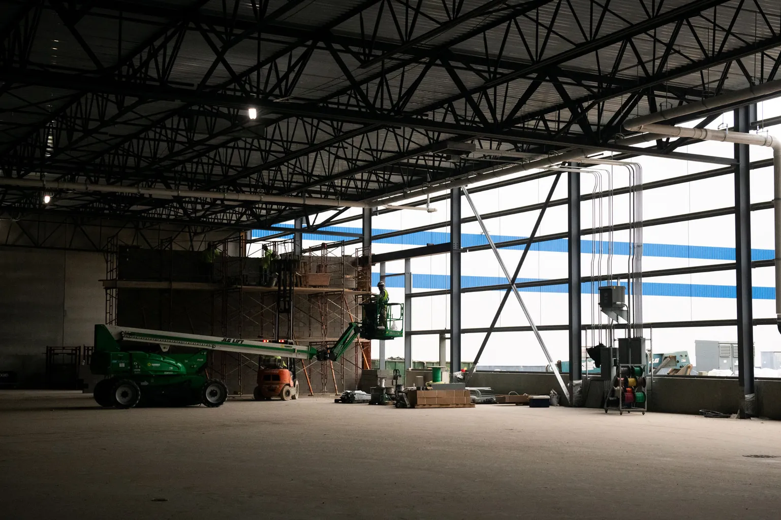 A crane sits off in the background on a construction site