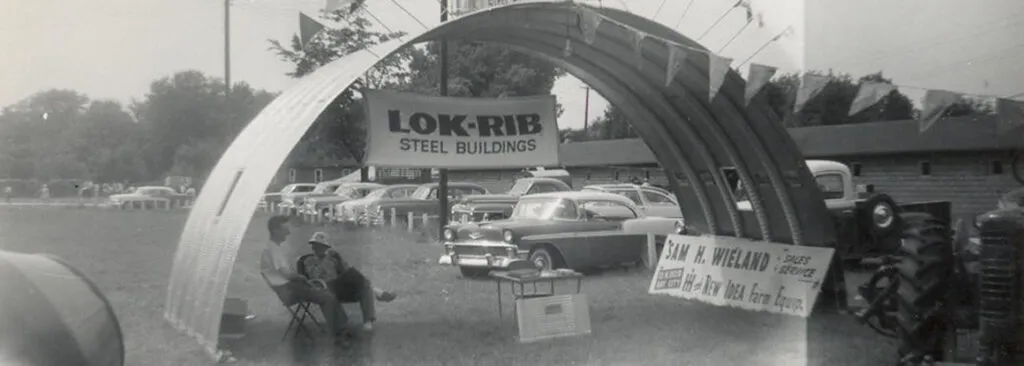 Historic photo of Sam H. Wieland's stand under a steel awning