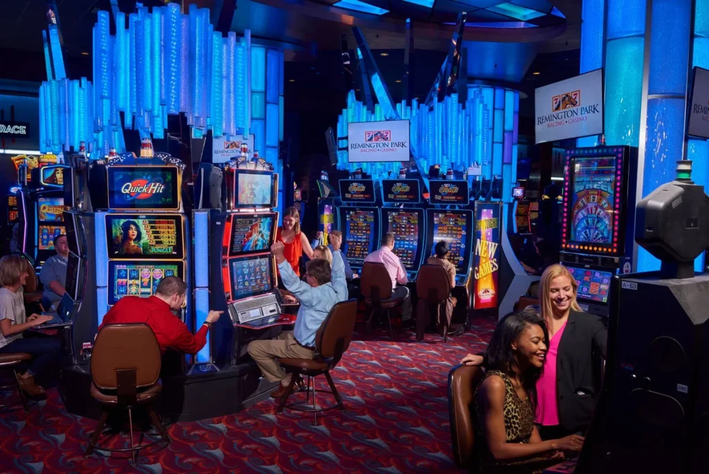 A bustling casino scene at Banco Casino, with people engaged in playing various slot machines.