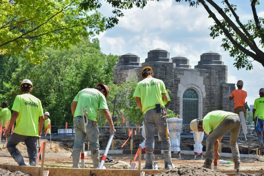 Construction completing the concrete pour at the Fish Ladder Music Park