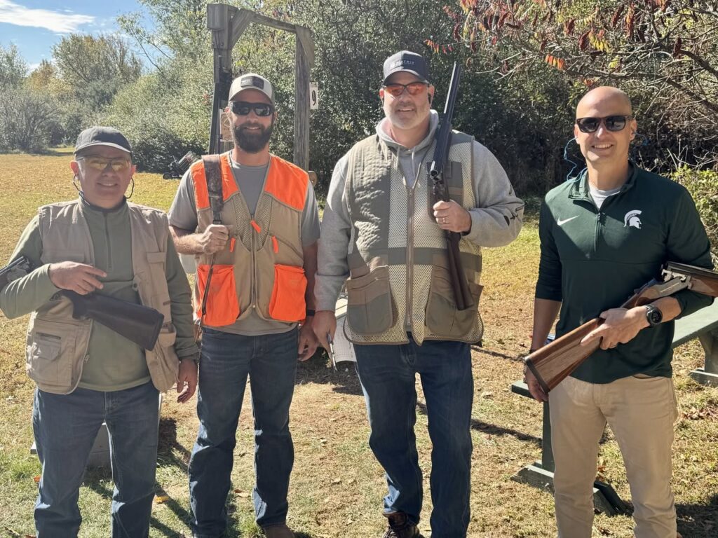 Group posing for a photo at the Clays for Raise