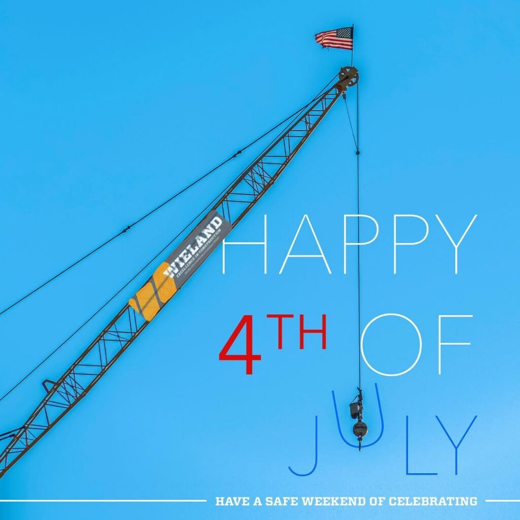 Graphic of a crane lowering the "U" into "Happy 4th of July"