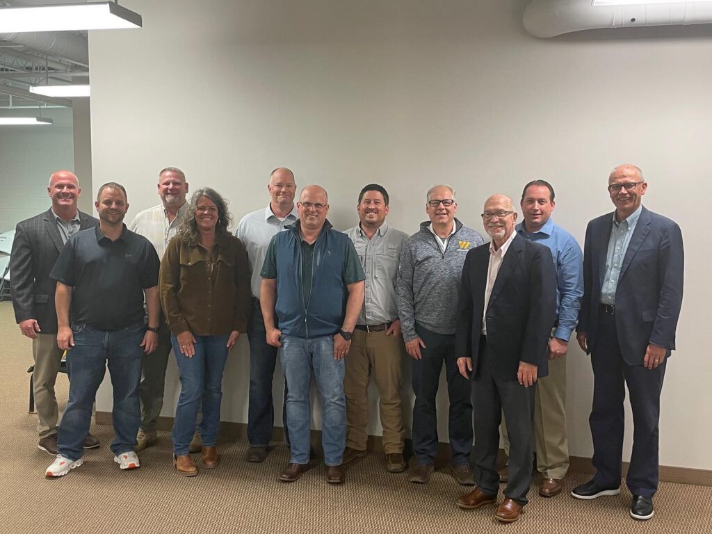 Group standing around for a photo after completing their training