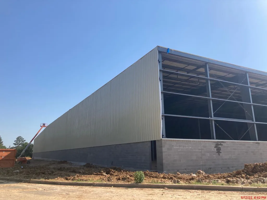 Siding being added to the exterior façade of the building 