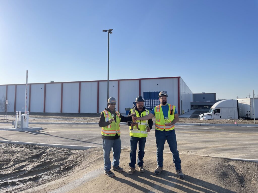 Group of men gathered with their awards