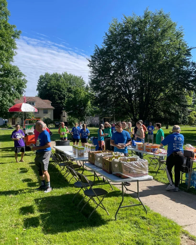 volunteers handing out food after the race's conclusion 