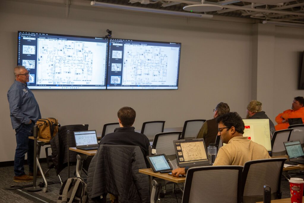 Group gathered in a single room to discuss pull planning tactics