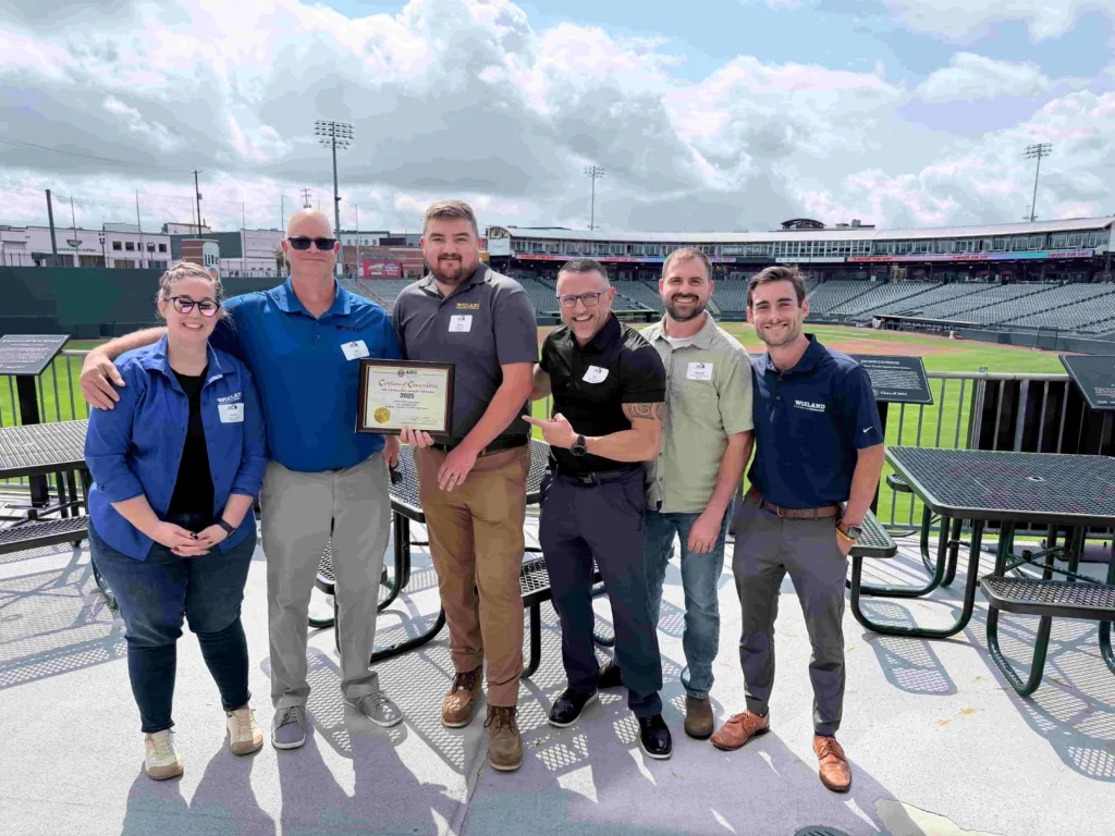 Group gathered for a photo after presentation of the AGC NASA award