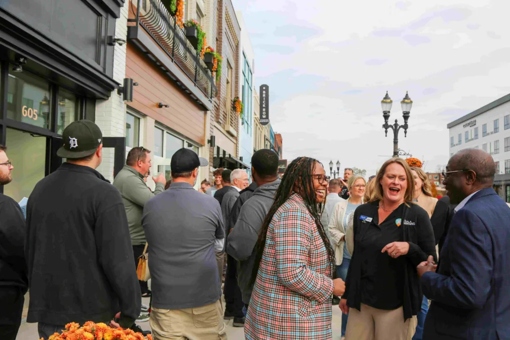 Lansing residents showing up for the ground break ceremony. Over 150 individuals showed up to celebrate the grand opening of Brick Row.